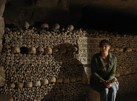 Kristina Killgrove photographed in ossuary in Paris catacombs