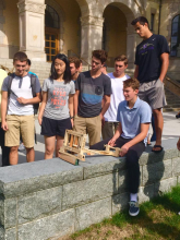 students demonstrate their model of ancient military technology