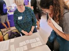 Prof. Connors watches student match Taylor Swift song titles to Latin translations.