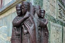 Four nearly identical sculptures of emperors