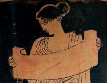 redfigure vase painting of woman reading from a scroll