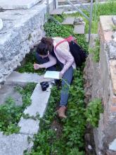 student at ostia transcribing an inscription