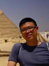 Person in front of Pyramid