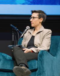 Seated woman in blazer