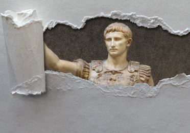 Roman statue of a man emerging from a frame of torn paper