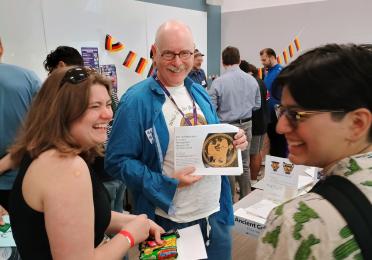 Prof. Hollmann helps students read a Greek vase inscription.
