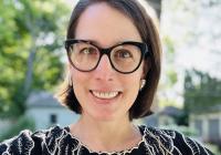 photo of a woman with chin-length hair and glasses