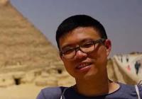 Person in front of Pyramid